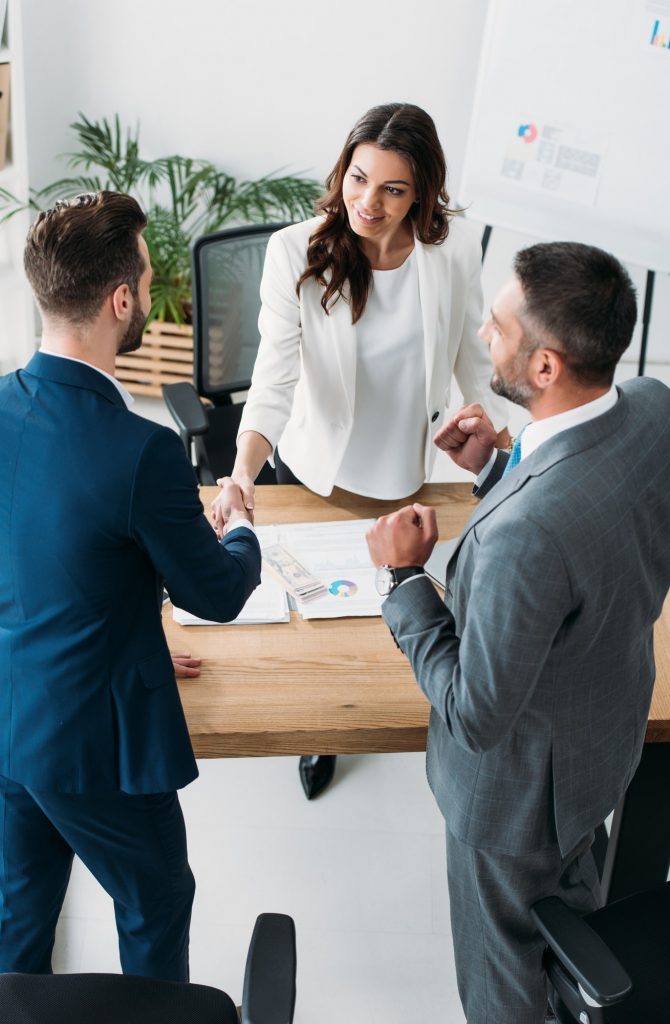 beautiful-advisor-and-handsome-investor-shaking-hands-at-workplace-q1t3qrm1oyczqgr0aq5c0zk1s6vrgg2zkc8qtz62yo